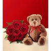 brown teddy bear with roses