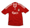 given a liverpool shirt