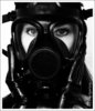 a shiny black rubber gas mask