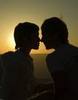 A romantic sunset kiss